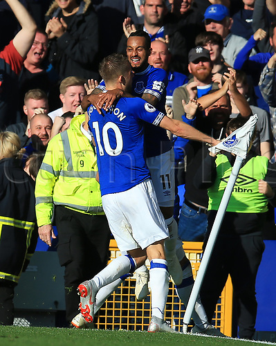 29th September 2018, Goodison Park, Liverpool, England; EPL Premier League Football, Everton versus Fulham; Gylfi Sigurdsson of Everton celebrates his goal with his team mate Theo Walcott in front of the fans in the Gwladys Street end