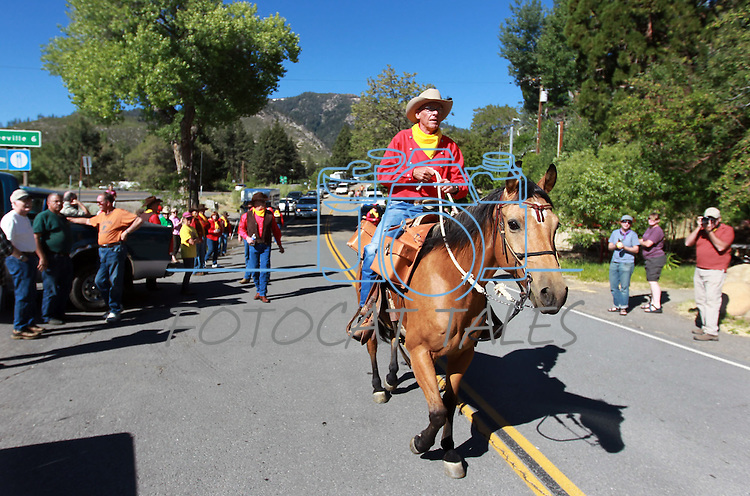 Carl Malkmus and his horse BB begin their leg of the Pony Express Re-ride in Woodfords, Ca., on Thursday, June 14, 2012. About 600 riders retrace the historic route to deliver the mochila full of mail from Sacramento to St. Joseph, Missouri. In it's 152nd year, the event spans 10 days and 1,966 miles. .Photo by Cathleen Allison