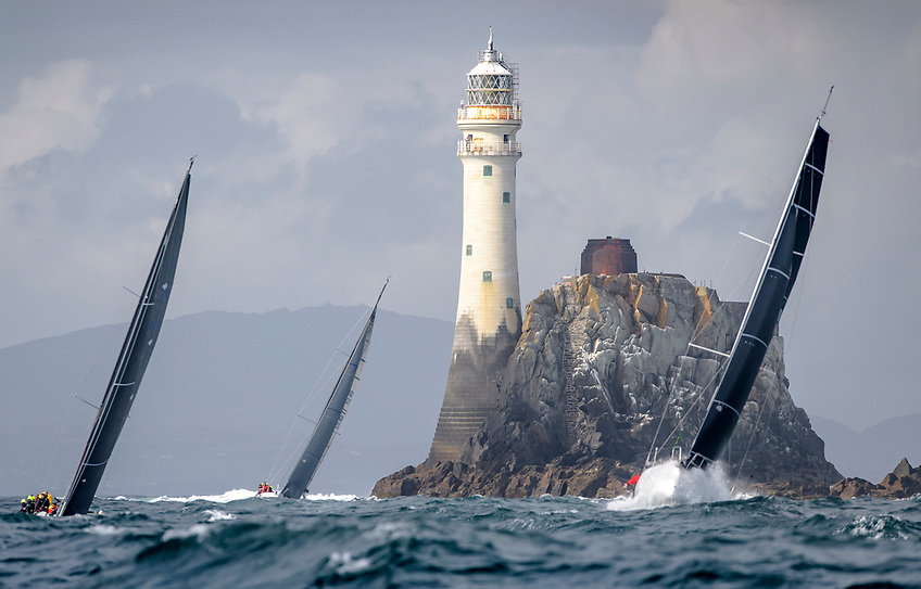 Yachts rounding the rock in the Rolex Fastnet Race 2019. 2025 sees the 100th-anniversary edition of the famous offshore race 