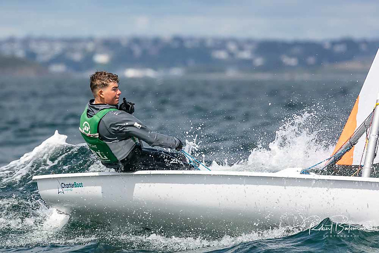 Rocco Wright is in a three-way tie for his event in the One-person Male dinghy event.  After posting a consistent day of two seventh places and a sixth, he is currently second overall on tie-break.