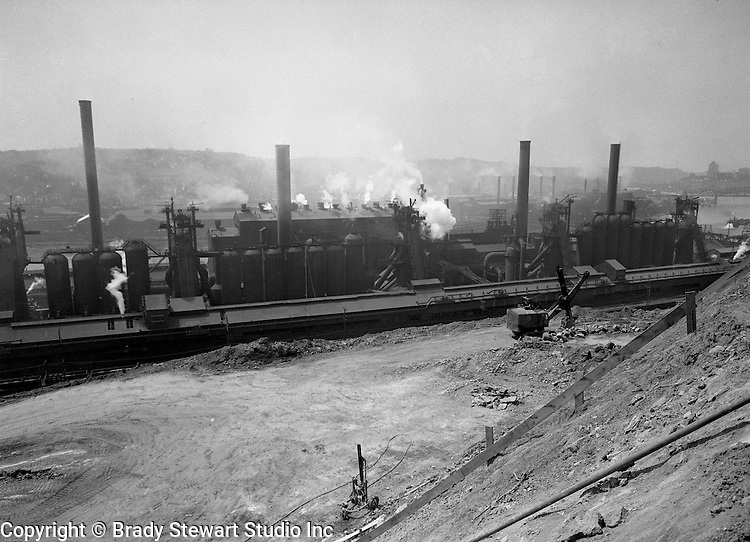 Pittsburgh PA: View of the Jones and Laughlin's Steel Mill in Hazelwood right across the river for J&L's South Side works. <br />
Jones and Laughlin Steel began producing Steel in 1886. They constructed one plant on the South Side and one plant across the river in Hazelwood. The company built the Hot Metal Bridge to connect the plants. They shipped raw materials (pig iron) from Hazelwood over to the blast furnaces on the South Side.<br />
J&L merged with Republic Steel in 1984 to form LTV Steel. The factories closed for good in 1997.