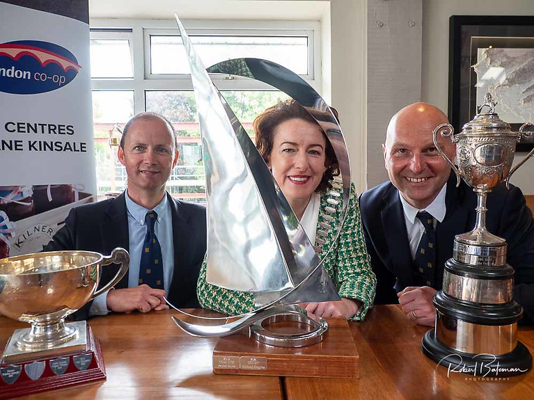 Kinsale Yacht Club's Ian Travers (Regatta Director), Mayor of County Cork Cllr. Gillian Coughlan and Matthias Hellstern (Commodore Kinsale YC) with the prestigious trophies for June's Squib National Championships 