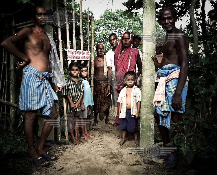Villagers at the local temple, which also acts as a campaign office for the group opposing plans to sell their land to the steel company Posco. All the residents of this village would be displaced if plans for the new steel works are allowed to proceed. South Korean steel giant Posco continues to face stiff public resistance in Orissa's Jagatsinghpur district where the company is setting up India's biggest direct foreign investment project of a 12 million tonne steel plant, at the cost of USD 12 Billion. Villagers have formed an agitating group, "Posco Pratirdh Sangram Samiti" to oppose the construction of the Posco development, which will displace thousands of people and make agricultural land untenable.