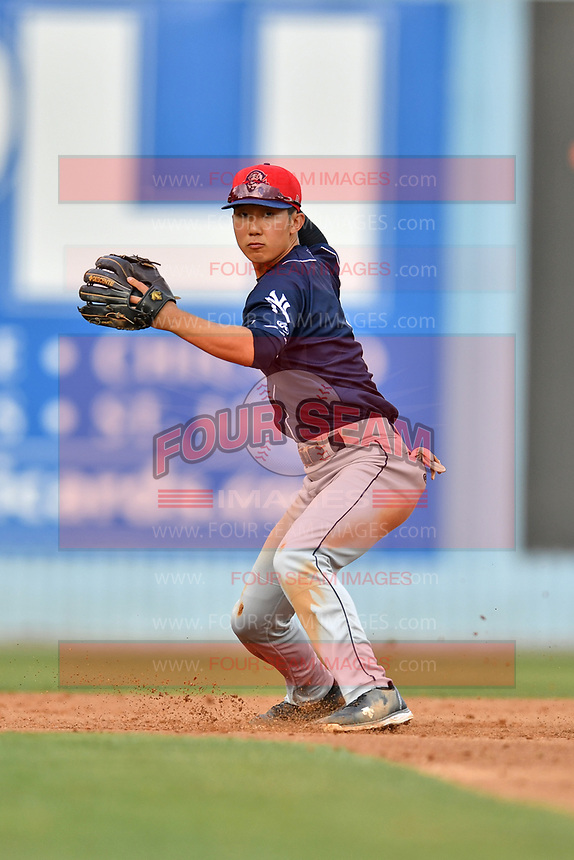 Charleston RiverDogs shortstop Hoy Jun Park (1) makes the throw to complete a double play during over a hard sliding Jose Gomez (4) during during a game against the Asheville Tourists at McCormick Field on July 4, 2017 in Asheville, North Carolina. The Tourists defeated the RiverDogs 2-1. (Tony Farlow/Four Seam Images)