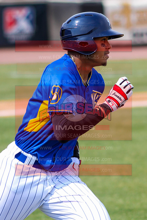 Wisconsin Timber Rattlers shortstop Gilbert Lara (11) runs to first base during a Midwest League game against the Quad Cities River Bandits on April 9, 2017 at Fox Cities Stadium in Appleton, Wisconsin. Quad Cities defeated Wisconsin 17-11. (Brad Krause/Four Seam Images)