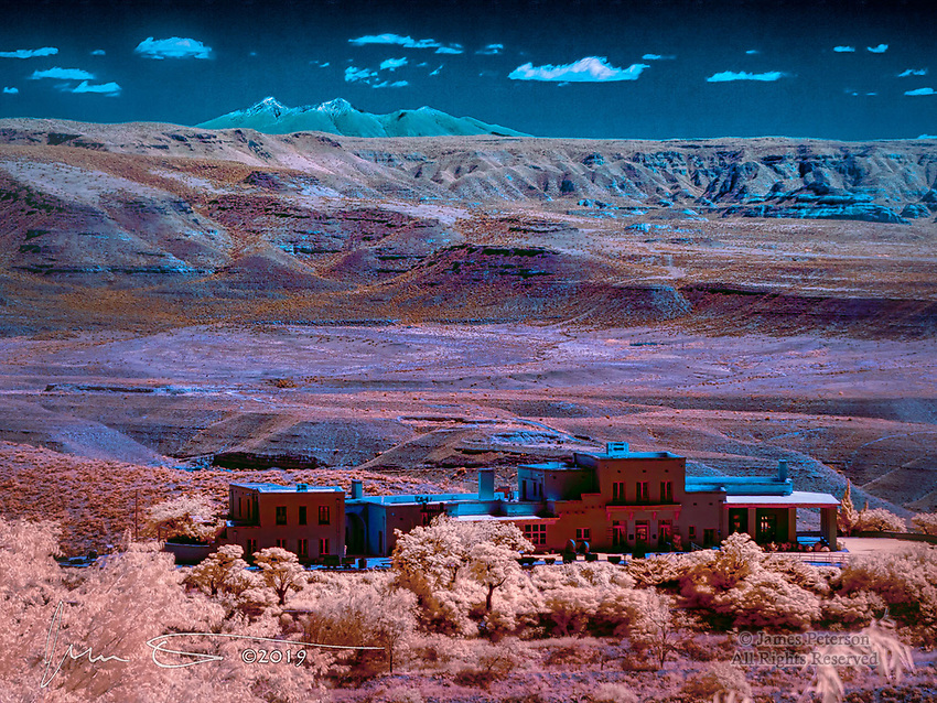 Jerome State Historic Park, Arizona (Infrared) ©2019 James D Peterson. Housed in the old Douglas mansion and with a commanding view of the Verde River Valley and the still snow covered San Francisco Peaks north of Flagstaff, this museum has a remarkable collection of memorabilia, artifacts, and information from the heyday of what was once a booming mining town. After the ore ran out, the town was mostly abandoned and falling into ruin, but it was then revived as an arts and historic destination. The (false) colors of this infrared photo, captured from the Sullivan Hotel, reveal details in this landscape that would otherwise be invisible.