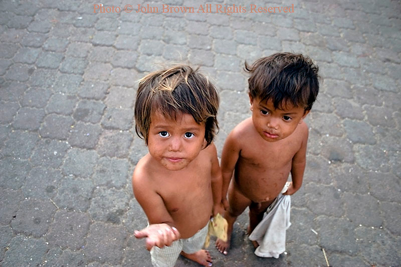 two-hungry-street-children-boys-living-in-poverty-are-in-need-of-food