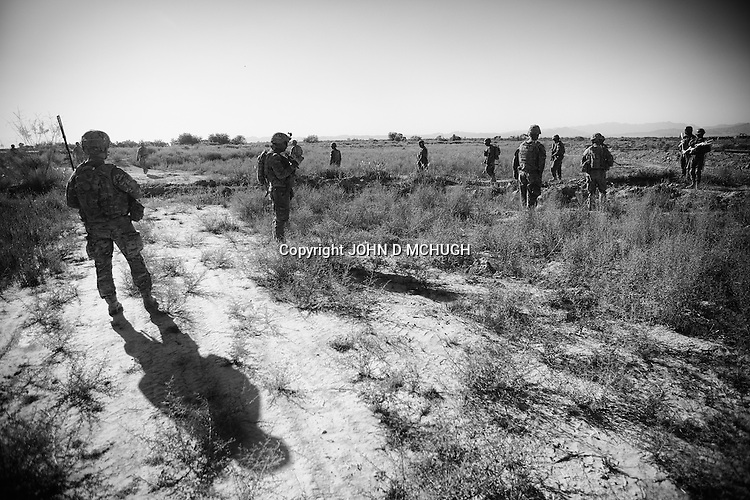 Soldiers from Bayonet Company, 1-38 Infantry head out for another patrol after a five hour firefight with the Taliban in Pay-E Moluk village earlier in the day, Panjwayi district, Kandahar, 30 April 2013. (John D McHugh)