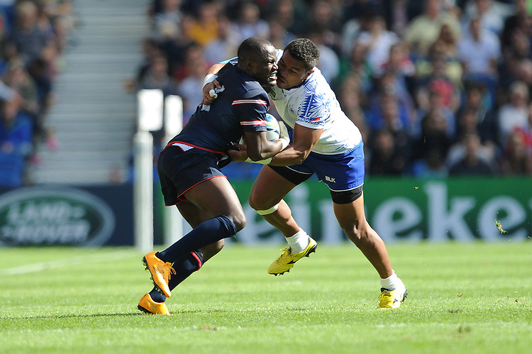 Takudzwa Ngwenya of USA tussles with Fa'atoina Autagavaia of Samoa during Match 6 of the Rugby World Cup 2015 between Samoa and USA - 20/09/2015 - Brighton Community Stadium, Brighton <br />
Mandatory Credit: Rob Munro/Stewart Communications