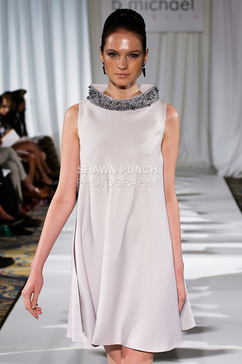 Tania walks runway in a dove gray cobra embossed silk, raffia fabric trapeze with hand embroidered beaded collar from the b Michael AMERICA Couture Spring 2013 collection during Mercedes-Benz Fashion Week Spring 2013, at the Jumeirah Essex House on September 12, 2012.