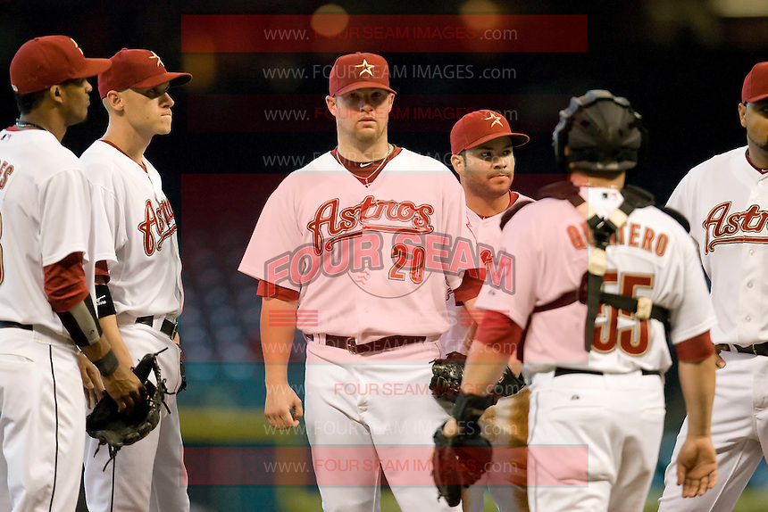 Houston Astros pitcher Bud Norris #20 meets with his infielders during the Major League Baseball game against the Philadelphia Phillies at Minute Maid Park in Houston, Texas on September 14, 2011. Philadelphia defeated Houston 1-0. (Andrew Woolley/Four Seam Images)