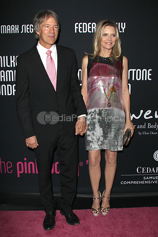 SANTA MONICA, CA - OCTOBER 27: David E. Kelley and Michelle Pfeiffer at the 8th annual Pink Party hosted by Michelle Pfeiffer to benefit Cedars-Sinai Women's Cancer Program at HANGAR:8 on October 27, 2012 in Santa Monica, California. Credit: mpi21/MediaPunch Inc.
