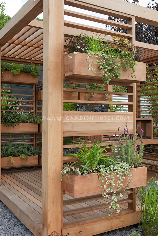 Covered Deck with windowbox container garden is a creative use of backyard space and landscaping idea for vertical space