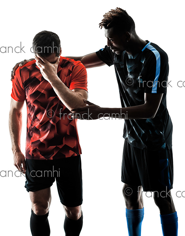 two soccer players men in studio silhouette isolated on white background
