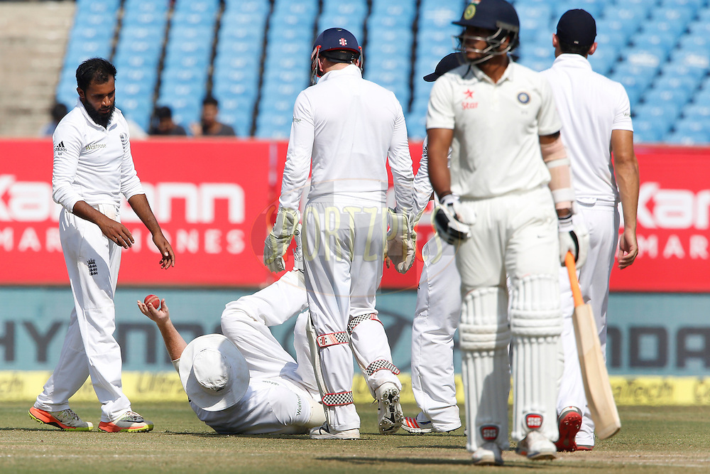 Ben Stokes, Adil Rashid of England celebrates the wicket of Umesh Yadav of India during day 4 of the first test match between India and England held at the Saurashtra Cricket Association Stadium , Rajkot on the 12th November 2016.<br />
<br />
Photo by: Deepak Malik/ BCCI/ SPORTZPICS