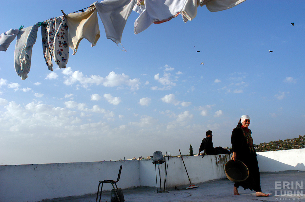 Sameera Toumeh hangs laundry to dry on the roof of her home in the northern West Bank village of Qaffin...Photo by Erin Lubin