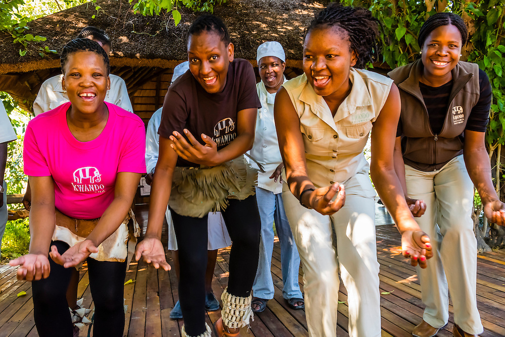 Staff members of the Lebala Safari Camp at the Kwando Concession do a traditional singing and dancing performance, Botswana.