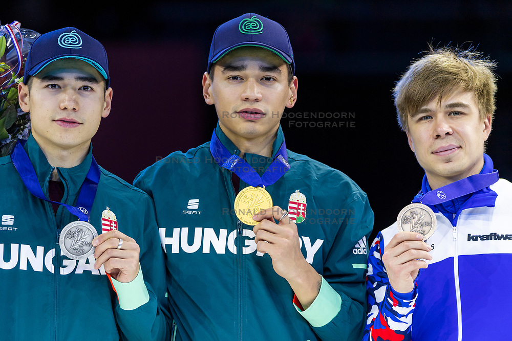 12-01-2019 NED: ISU European Short Track Championships 2019 day 2, Dordrecht<br />
(L-R) Shaoang Liu and Shaolin Sandor Liu of Hungary and Semen Elistratov of Russia pose in the Men's 1500m medal ceremony during the ISU European Short Track Speed Skating Championships