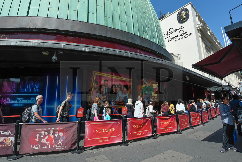 © Licensed to London News Pictures. 28/06/2019. LONDON, UK. Tourists queue up to enter Madame Tussauds near Baker Street. Danish company Kirkbi Invest, which controls the Lego toy firm, has agreed to pay £4.8bn for Merlin Entertainments. Merlin owns the Madame Tussauds as well as the London Eye, Alton Towers, Chessington Adventures as well as other UK attractions. Photo credit: Stephen Chung/LNP