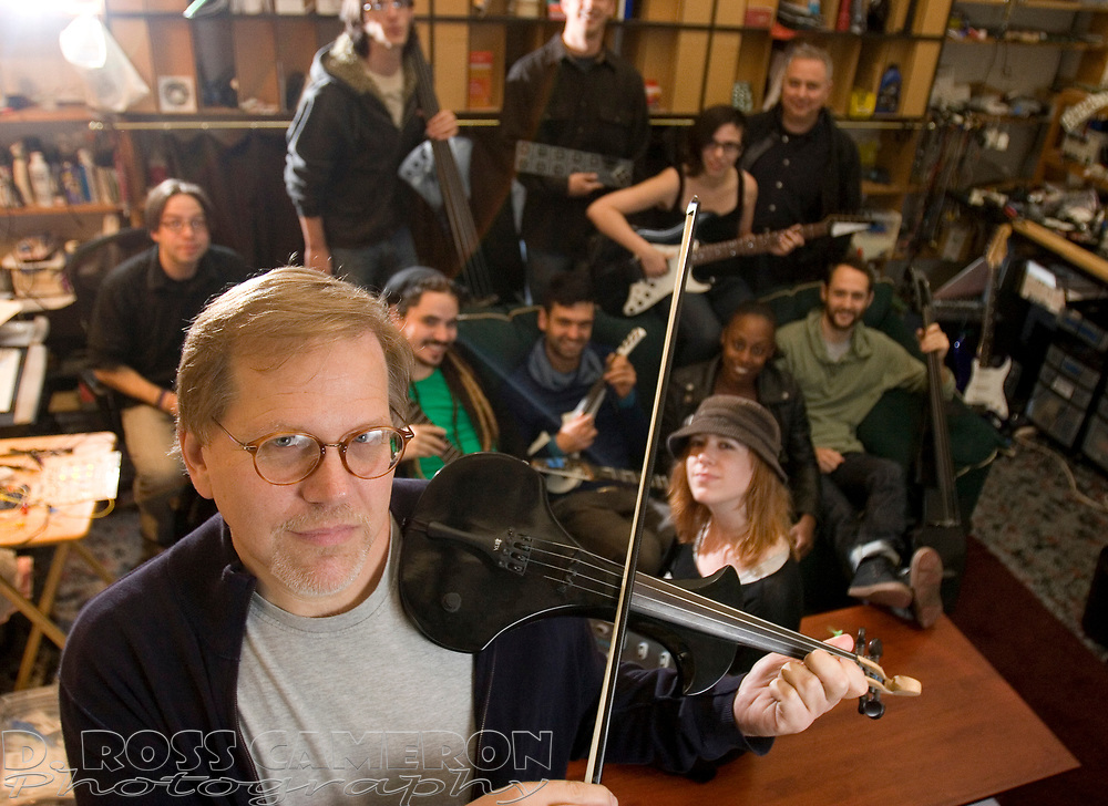 Keith McMillen, foreground, poses for a photograph with his "backing band" -- the software engineers and designers who work to develop electronic musical devices like foot switches and Bluetooth violin bows for his company, Keith McMillen Instruments, Tuesday, Oct. 4, 2011 in Berkeley, Calif. (D. Ross Cameron/Staff)