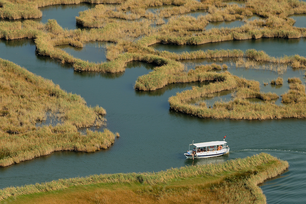 In the Dalyan Delta in Turkey the river artfully creates patterns of water and reed before reaching the beachfront to the open Mediterranean Sea. The brackish water is home of the Nile soft-shelled turtle (Trionyx triunguis).