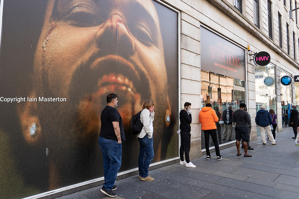 Glasgow, Scotland, UK. 12 June 2020. View of people queuing to enter Barclays Bank on Argyll Street in Glasgow city centre. Although shops can reopen in England next week , in Scotland the lockdown is not being relaxed so quickly with several more weeks of restrictions to go. Shops and businesses remain closed and streets are very quiet. Iain Masterton/Alamy Live News