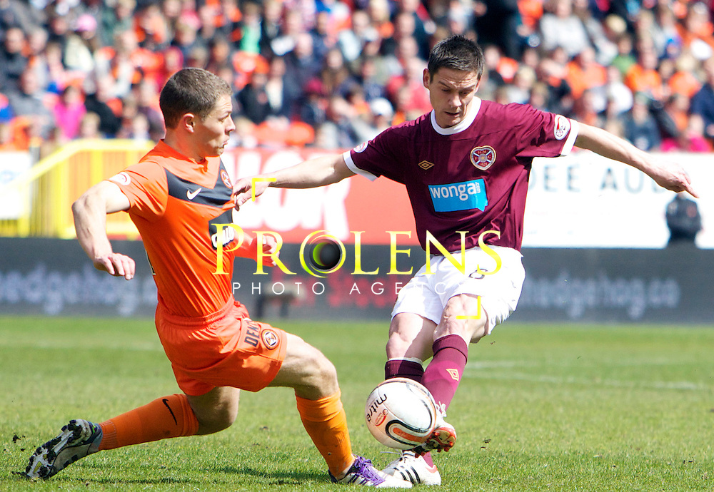 SPL Dundee United FC v Hearts FC Scottish Premier League Season 2011-12.28-04-12...HEARTS Ian Black has a shot at goal but is blocked by United's John Rankin during the Scottish premier League clash between Euro spot chasing Dundee United FC and Heart of Midlothian FC...At Tannadice Stadium, Dundee..Saturday 28th April 2012.Picture Mark Davison/ Prolens Photo Agency / PLPA