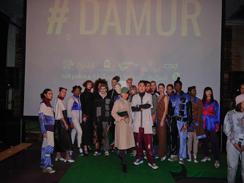 DEU, Deutschland, Berlin, 16.01.2020 /<br />
Shih-Shun Huang (in white jacket), Founder & Creative Director of the Berlin-based fashion label DAMUR, poses with friends, models and influencers after the presentation of his new collection at the Griessmuehle, Berlin. The fashion show was part of the Berlin Fashion Week, where the new Fall/ Winter 2020 collections were being presented.