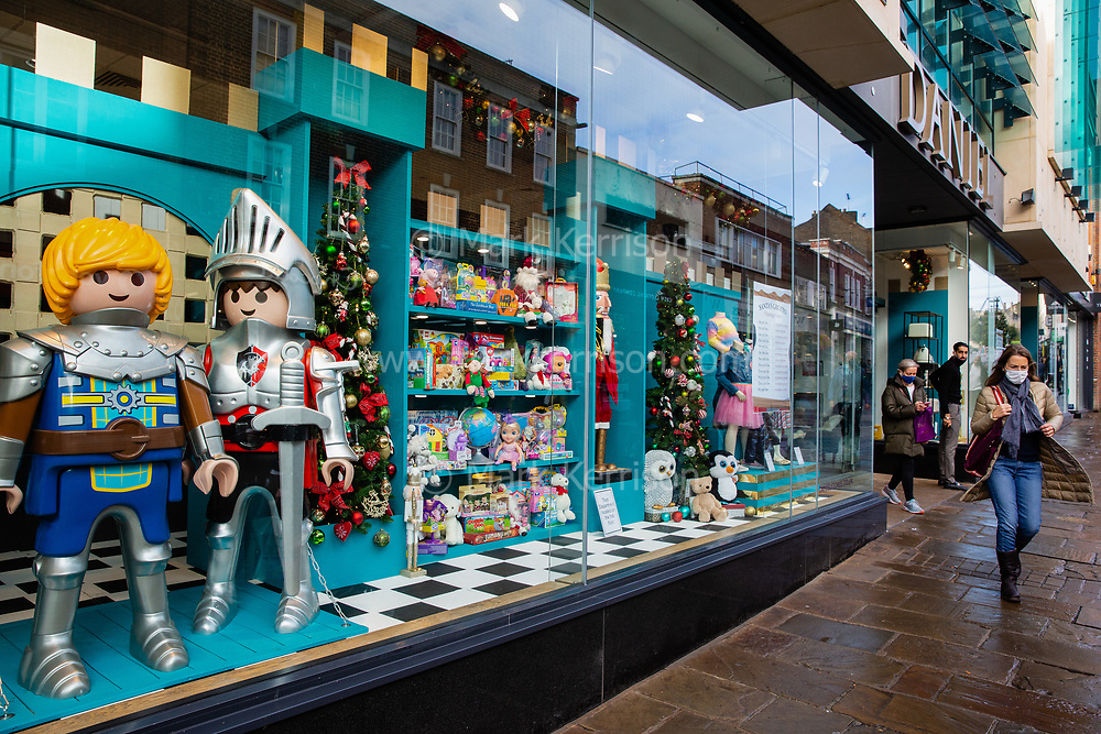 Shoppers leave a department store decorated for Christmas on 12th December 2021 in Windsor, United Kingdom. According to the Office of National Statistics (ONS), British households are spending more on goods and less on services as the Omicron coronavirus variant spreads.