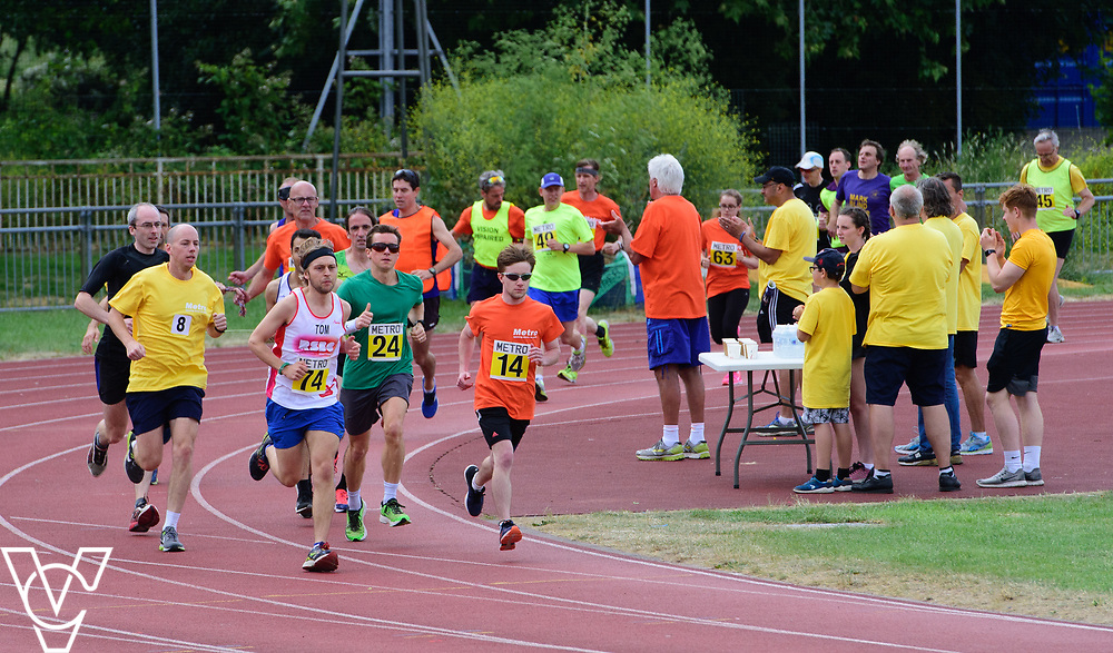 Event: 5000 meter relay<br />
Competitors, from left: Luke Boulding, Competitor #74, Rhys Jones and Tom Barton<br />
<br />
Metro Blind Sport's 42nd Athletics Open, held at Mile End Stadium, Tower Hamlets, London.<br />
<br />
Picture: Chris Vaughan Photography for Metro Blind Sports<br />
Date: June 16, 2018