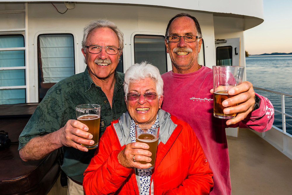 Passengers aboard the Un-Cruise small cruise ship "Wilderness Explorer", Nakwasina Sound, Inside Passage, Southeast Alaska USA.