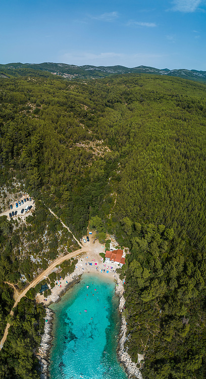 Aerial view of a few sailboats along the coast near the bay in Cara, Korcula, Croatia.