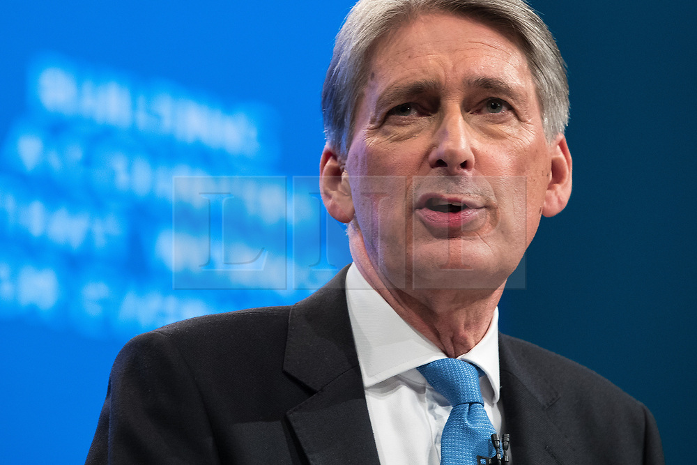 © Licensed to London News Pictures . 02/10/2017. Manchester, UK. Chancellor PHILIP HAMMOND delivers his keynote speech , during the second day of the Conservative Party Conference at the Manchester Central Convention Centre . Photo credit: Joel Goodman/LNP