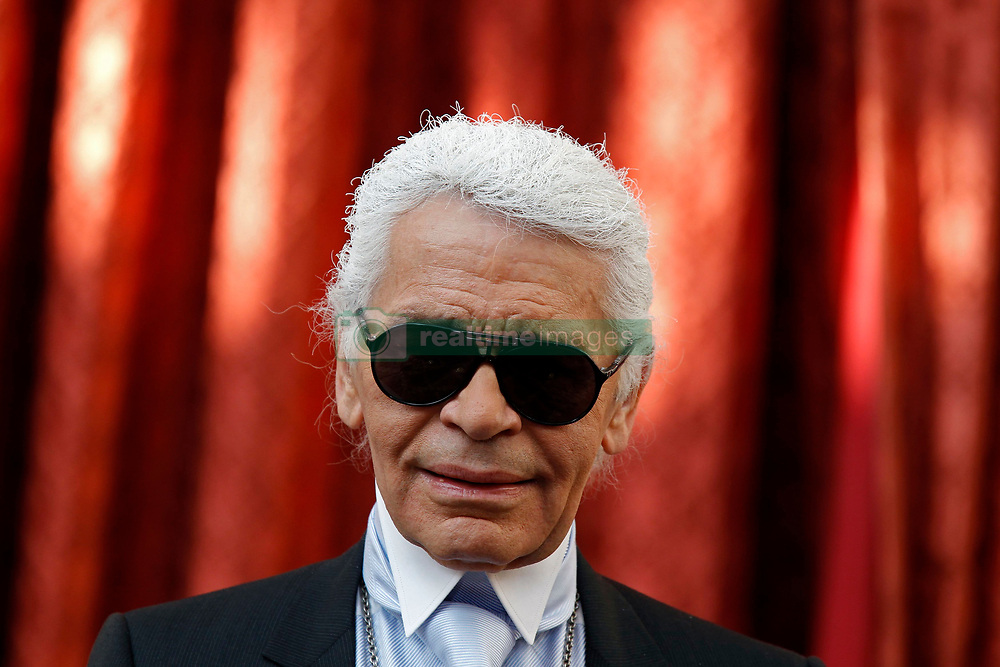 German fashion designer Karl Lagerfeld attends a ceremony where he received the Commander's Cross of the Legion of Honour (Croix de Commander de la Legion d'Honneur) at the Elysee Palace in Paris, France on June 3, 2010. Photo by Jacky Naegelen/Pool/ABACAPRESS.COM