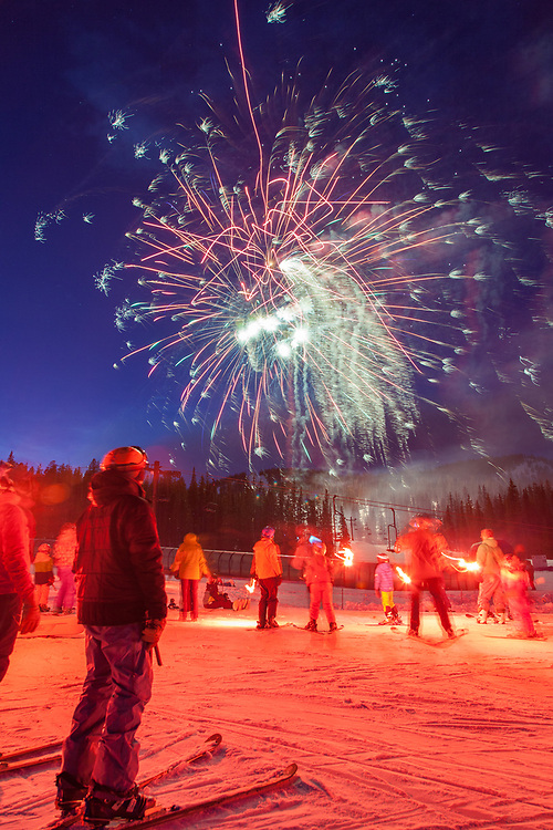 Fireworks fill the sky, following a torchlight parade on New Year's Eve at Monarch Mountain.