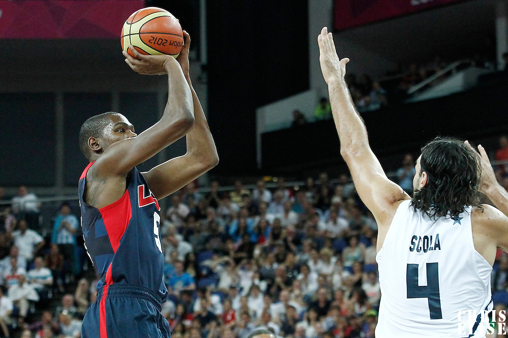 10 August 2012: USA Kevin Durant takes a jumpshot over Argentina Luis Scola during 109-80 Team USA victory over Team Argentina, during the men's basketball semi-finals, at the North Greenwich Arena, in London, Great Britain.