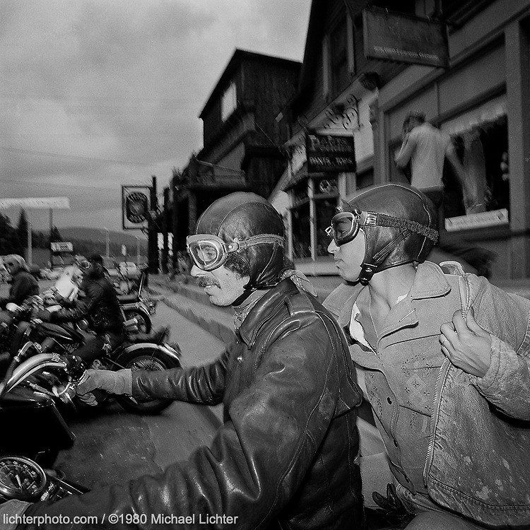 Sportster John & Arlene’s Wedding. Evergreen, CO. 1980<br />
<br />
Limited Edition Print from an edition of 50. Photo ©1980 Michael Lichter.<br />
<br />
The Story: When Sportster John and Arlene married in Eldorado Springs, CO, the big question was would he still be “Sportster John” even though his bride surprised him with keys to a brand new “Wideglide.” As part of the festivities, we rode to the Little Bear in Evergreen but clouds moved in and we moved out. The moniker lasted. The marriage didn’t.