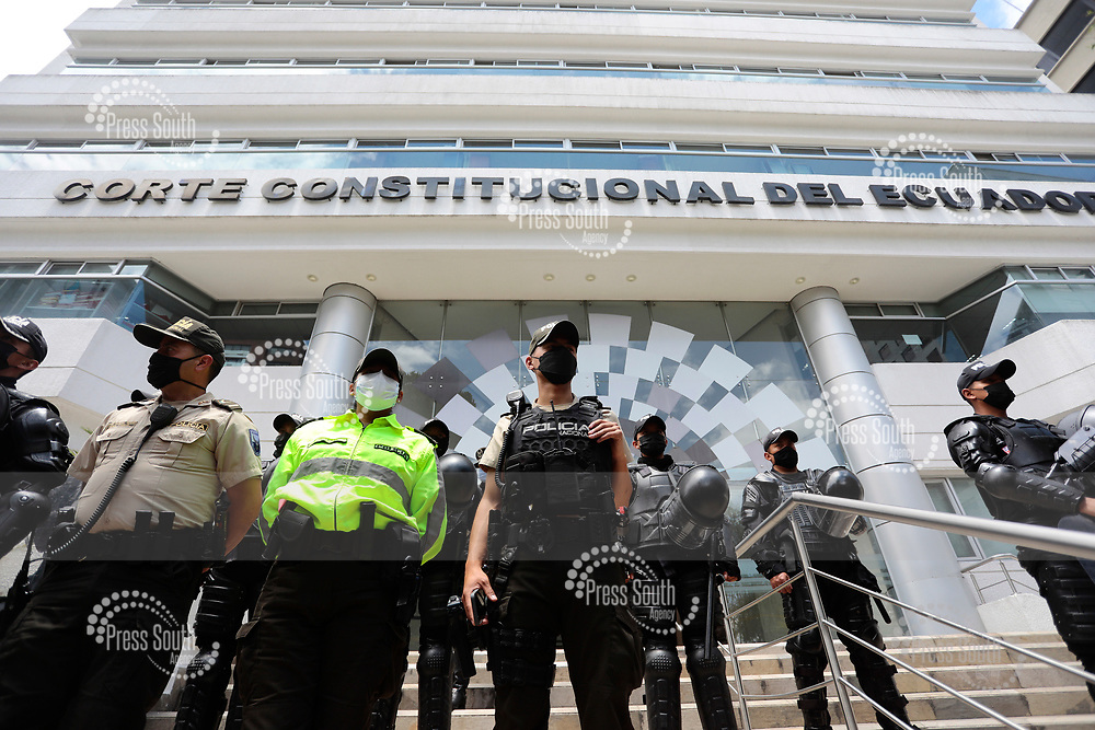 QUITO, ECUADOR - OCTOBER 18: Police guard the entrance to the Constitutional Court on October 18, 2021 in Quito, Ecuador. Indigenous people present a lawsuit before the Constitutional Court against President of Ecuador Guillermo Lasso¥s Decree 95, which seeks to expand oil extraction in the Ecuadorian amazon. (Photo by Frankln Jacome/Agencia Press South/Getty Images)