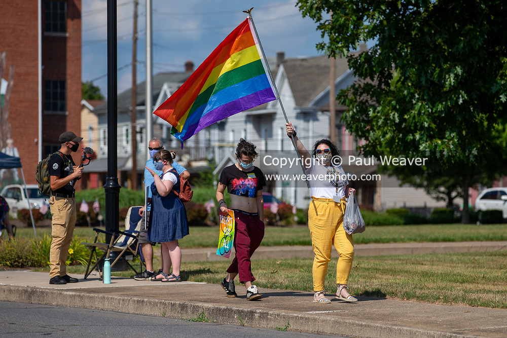 Victoria Mathews, founder of The I Am Alliance, waves a pride flag during the Milton Pride Rally in Milton, Pennsylvania on August 8, 2020. The I Am Alliance organized the event to show support for the LGBTQ community.