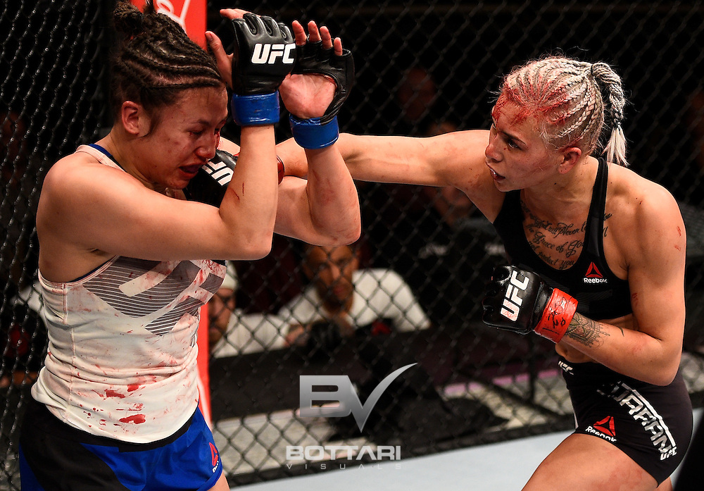 LAS VEGAS, NV - DECEMBER 03: (R-L) Kailin Curran punches Jamie Moyle in their women's strawweight bout during The Ultimate Fighter Finale event inside the Pearl concert theater at the Palms Resort & Casino on December 3, 2016 in Las Vegas, Nevada. (Photo by Jeff Bottari/Zuffa LLC/Zuffa LLC via Getty Images)