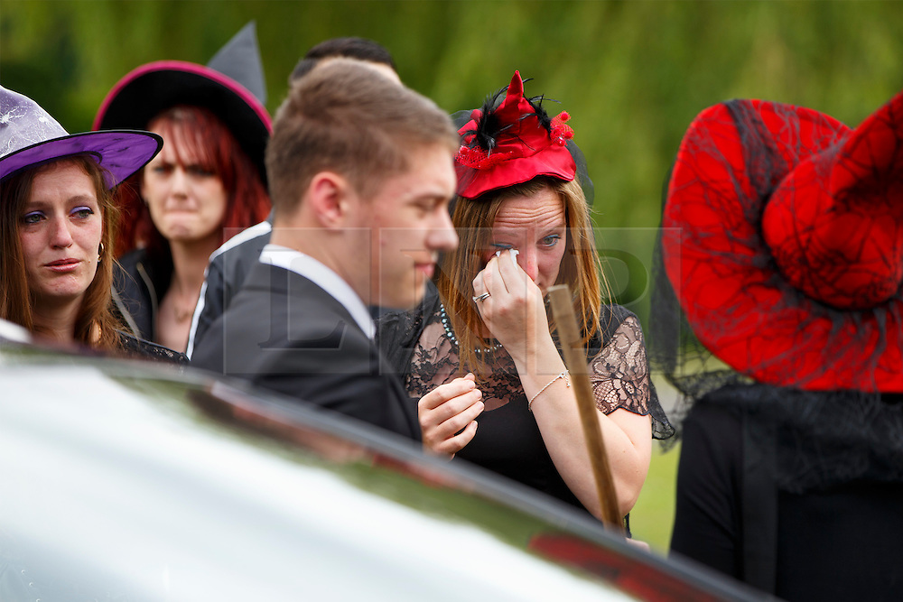 © Licensed to London News Pictures. 15/07/2015. Luton, UK. Friends and family attending Lorna Johnson's halloween themed funeral at Luton Crematorium in Luton on Wednesday, July 15, 2015. Lorna Johnson, 56 year old full time mother, loved halloween, fancy dresses and Star Wars and her family has requested that friends and family to attend her funeral wearing fancy dress. The Funeral Director, Brett Houghton of Co-op Funeralcare dressed up as Star Wars’ Darth Vader. Photo credit: Tolga Akmen/LNP