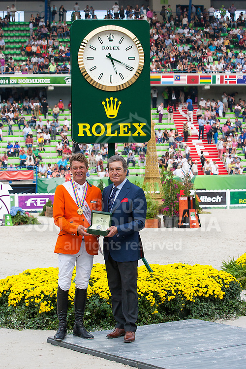 Jeroen Dubbeldam and Zenith SFN World Champion Jumping and Mr Philippe Schaeffer CEO Rolex France - Show Jumping Final Four - Alltech FEI World Equestrian Games™ 2014 - Normandy, France.<br />
© Hippo Foto Team - Leanjo de Koster<br />
07-09-14