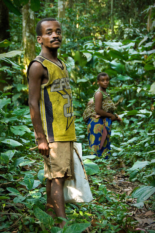 Sisko, an Mbuti tribe pygmy, with his wife, in the Okapi Wildlife Reserve of the Ituri Rainforest. The reserve is inhabited by close to 20,000 people, mostly Bantu origin agriculturalists, yet is also the home to thousands of semi-nomadic hunter-gatherer Mbuti and Efe pygmy tribes.