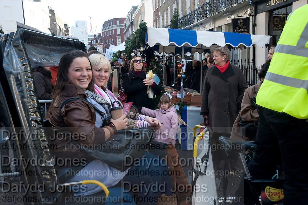 Belgravia Christmas Sunday. Elizabeth Street, Motcomb Street and Pimlico Rd. various Christmas activities. Father Christmas will also visited each street on his sleigh pulled by his reindeer. London. 6 December 2009<br />
<br />
*** Local Caption *** -DO NOT ARCHIVE-© Copyright Photograph by Dafydd Jones. 248 Clapham Rd. London SW9 0PZ. Tel 0207 820 0771. www.dafjones.com.<br />
Belgravia Christmas Sunday. Elizabeth Street, Motcomb Street and Pimlico Rd. various Christmas activities. Father Christmas will also visited each street on his sleigh pulled by his reindeer. London. 6 December 2009