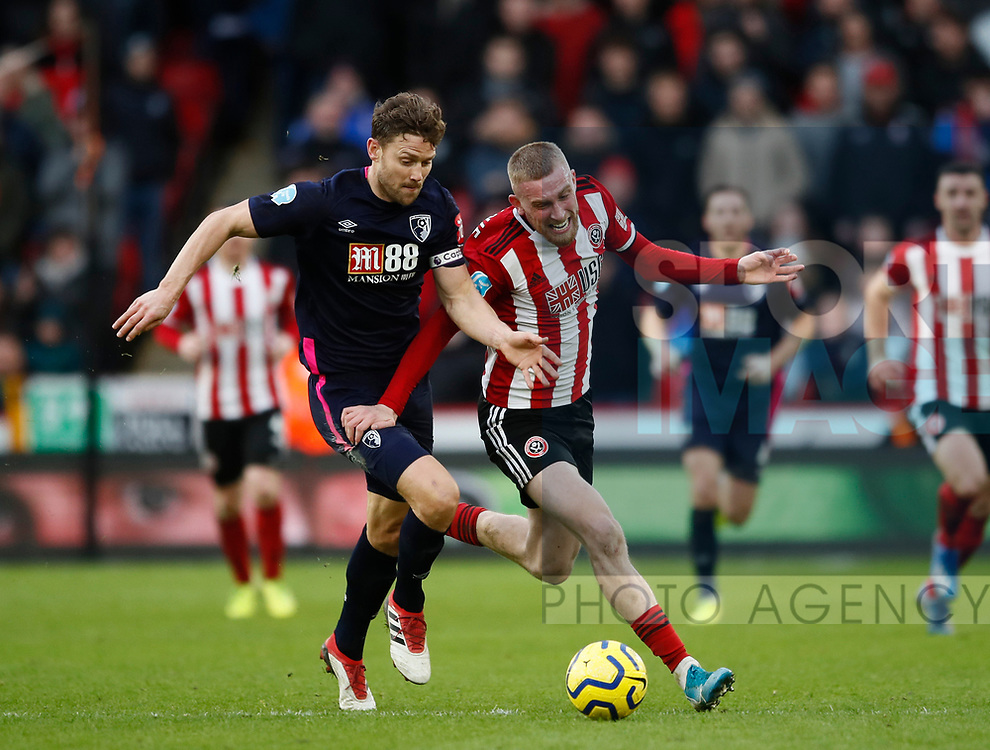 Oli McBurnie of Sheffield Utd tacked by Simon Francis of Bournemouth during the Premier League match at Bramall Lane, Sheffield. Picture date: 9th February 2020. Picture credit should read: Simon Bellis/Sportimage