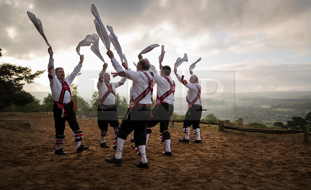 © Licensed to London News Pictures. 01/05/2017. Albury, UK. The Pilgrim Morris Men of Guildford dance at dawn on May Day on St Martha's Hill. Photo credit: Peter Macdiarmid/LNP
