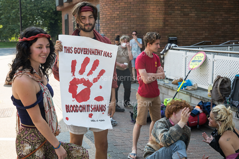 Young environmental activists from HS2 Rebellion wait with supporters before attending a hearing at High Wycombe Magistrates Court on 10th August 2020 in High Wycombe, United Kingdom. Seven, mainly teenage activists, appeared in court after having been arrested whilst standing on a bridge on a public footpath in Denham Country Park by police officers using the Trade Union and Labour Relations Act.