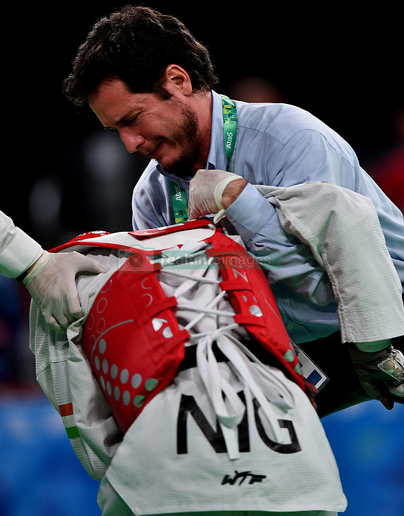 BUENOS AIRES, Oct. 9, 2018 Mahamadou Maharana Amadou T of Niger receives treatment during the taekwondo men's 55kg semifinal against Georgii Popov of Russia at the 2018 Summer Youth Olympic Games in Buenos Aires, Argentina on Oct. 8, 2018. Mahamadou Maharana Amadou T lost 13-33. (Credit Image: © He Changshan/Xinhua via ZUMA Wire)