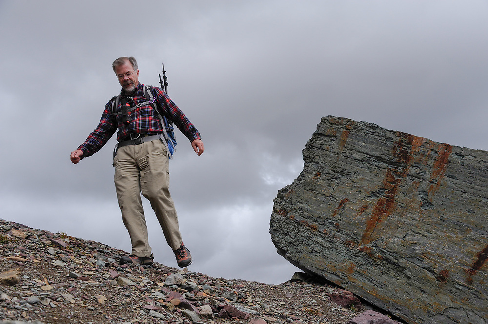 Dan Fagre Ph.D., a research ecologist with the USGS at the base of Mount Clements at Logan Pass, Glacier National Park, Montana , Tuesday, October 7, 2014. Fagre is using repeat photography to document disappearing glaciers using photos taken in the 1880’s (first exploration of this area by people with cameras) and since, and comparing them with the present day images he takes in the exact locations of the historic images to study and document the rate at which glaciers are disappearing.