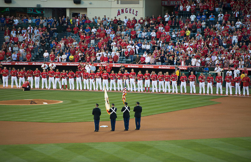 The Angels line up for the National Anthem before their home opener against the Chicago Cubs Monday at Angel Stadium.<br />
<br />
///ADDITIONAL INFO: <br />
<br />
angels.0405.kjs --- Photo by KEVIN SULLIVAN / Orange County Register -- 4/4/16<br />
<br />
The Los Angeles Angels take on the Chicago Cubs during their 2016 home opener Monday at Angel Stadium.<br />
<br />
<br />
4/4/16